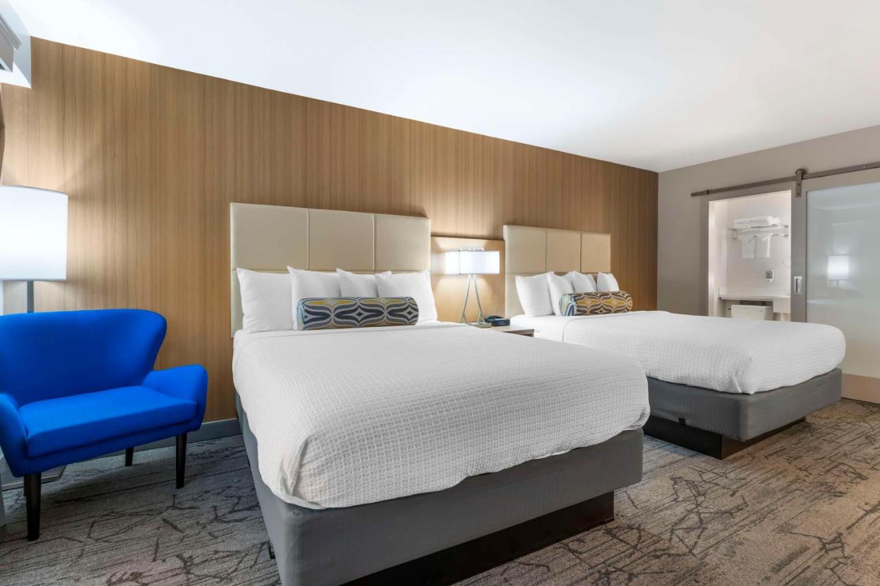 Queen Room with Two Queen Beds and Patio at Best Western Red Coach Inn