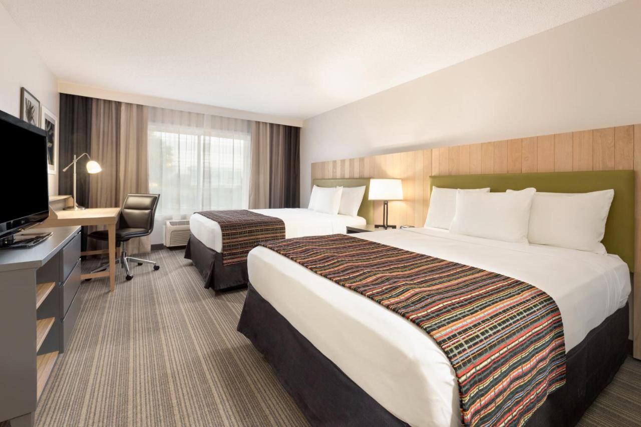Queen Room with Two Queen Beds at Country Inn & Suites by Radisson, Chippewa Falls, WI