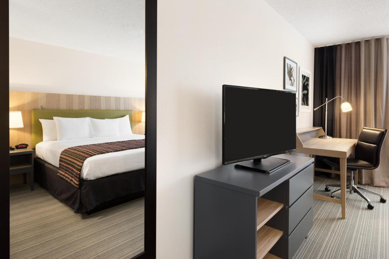 Queen Room with Two Queen Beds at Country Inn & Suites by Radisson, Chippewa Falls, WI