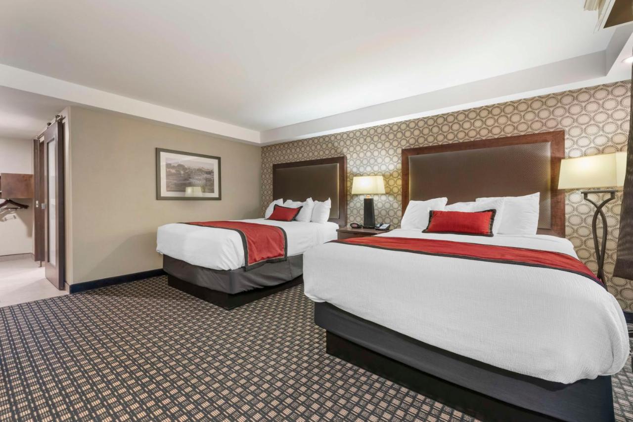 Queen Room with Two Queen Beds and Mobility Accessible Roll-In Shower at Best Western Plus Ramkota Hotel