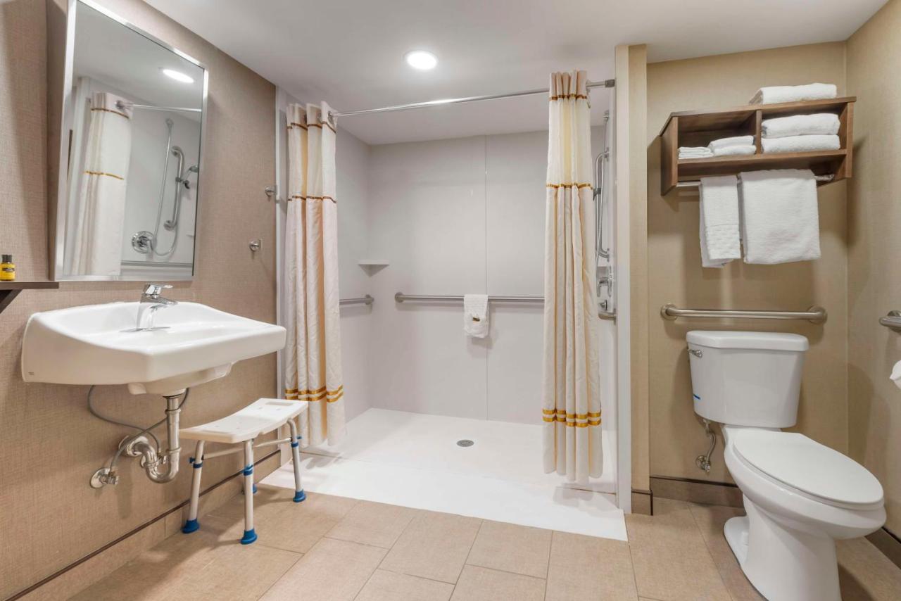 Queen Room with Two Queen Beds and Mobility Accessible Roll-In Shower at Best Western Plus Ramkota Hotel