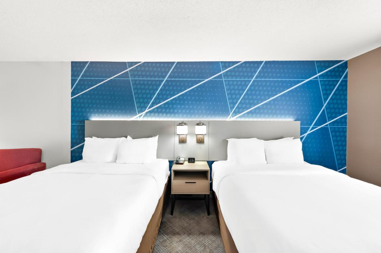Queen Room with Two Queen Beds and Sofa Bed at Comfort Suites Columbus