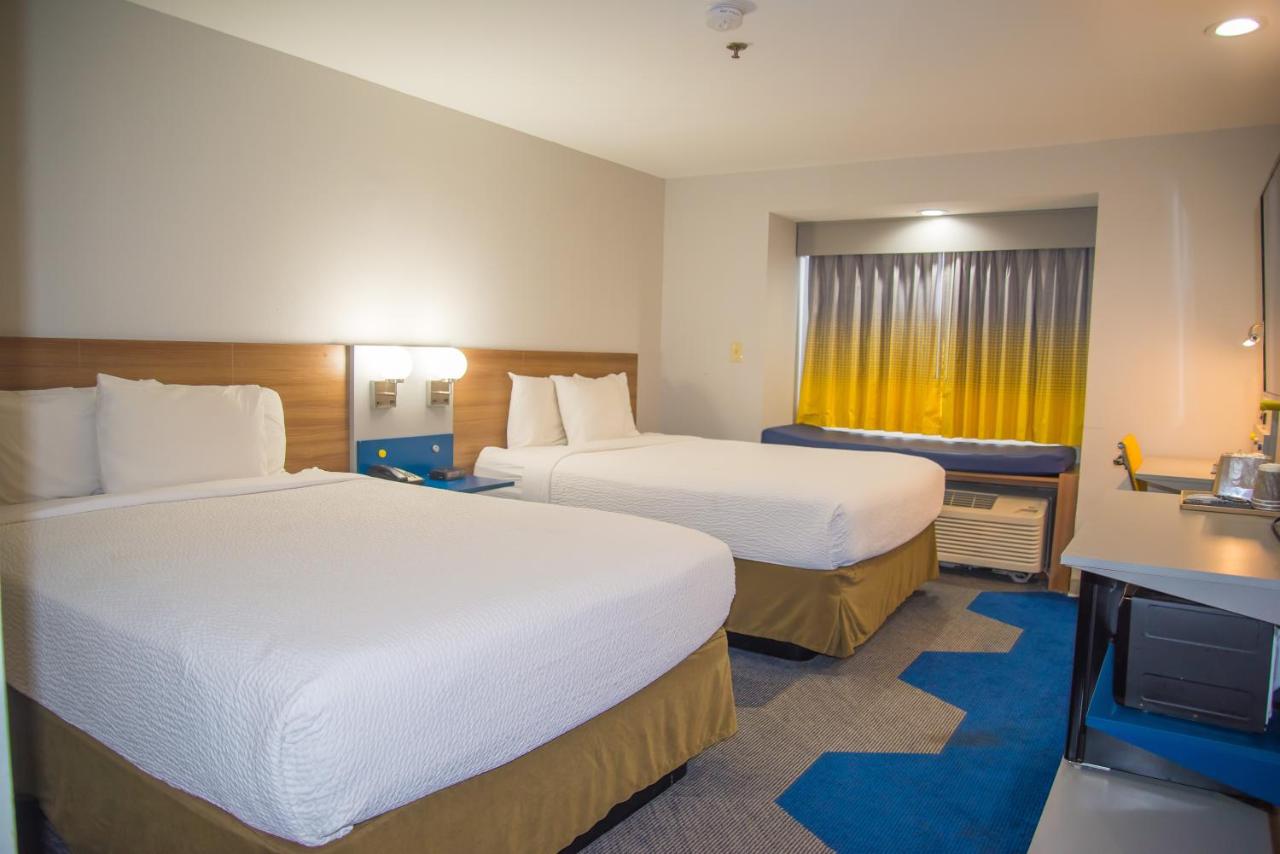 Queen Room with Two Queen Beds - Non-Smoking at Microtel Inn & Suites by Wyndham Daphne/Mobile