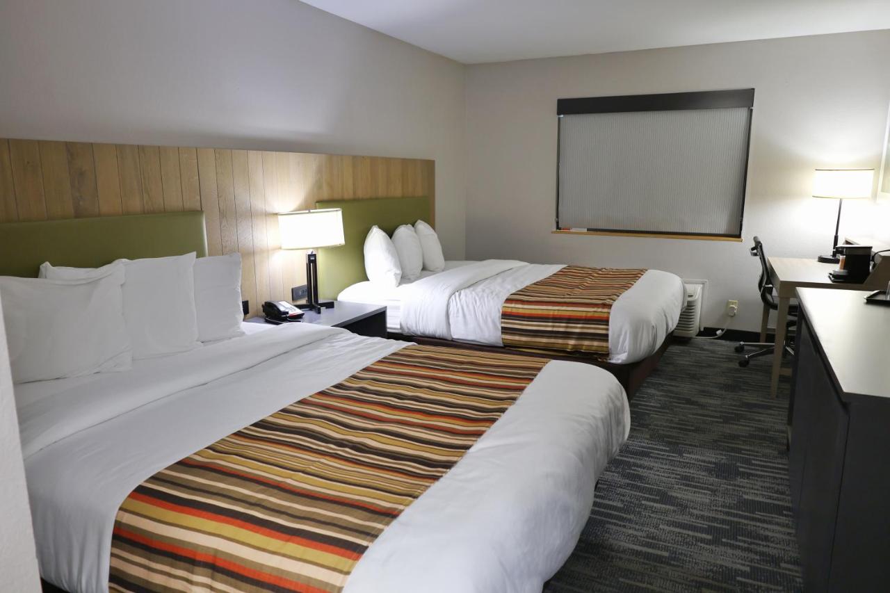 Queen Room with Two Queen Beds at Country Inn & Suites by Radisson, Sparta, WI