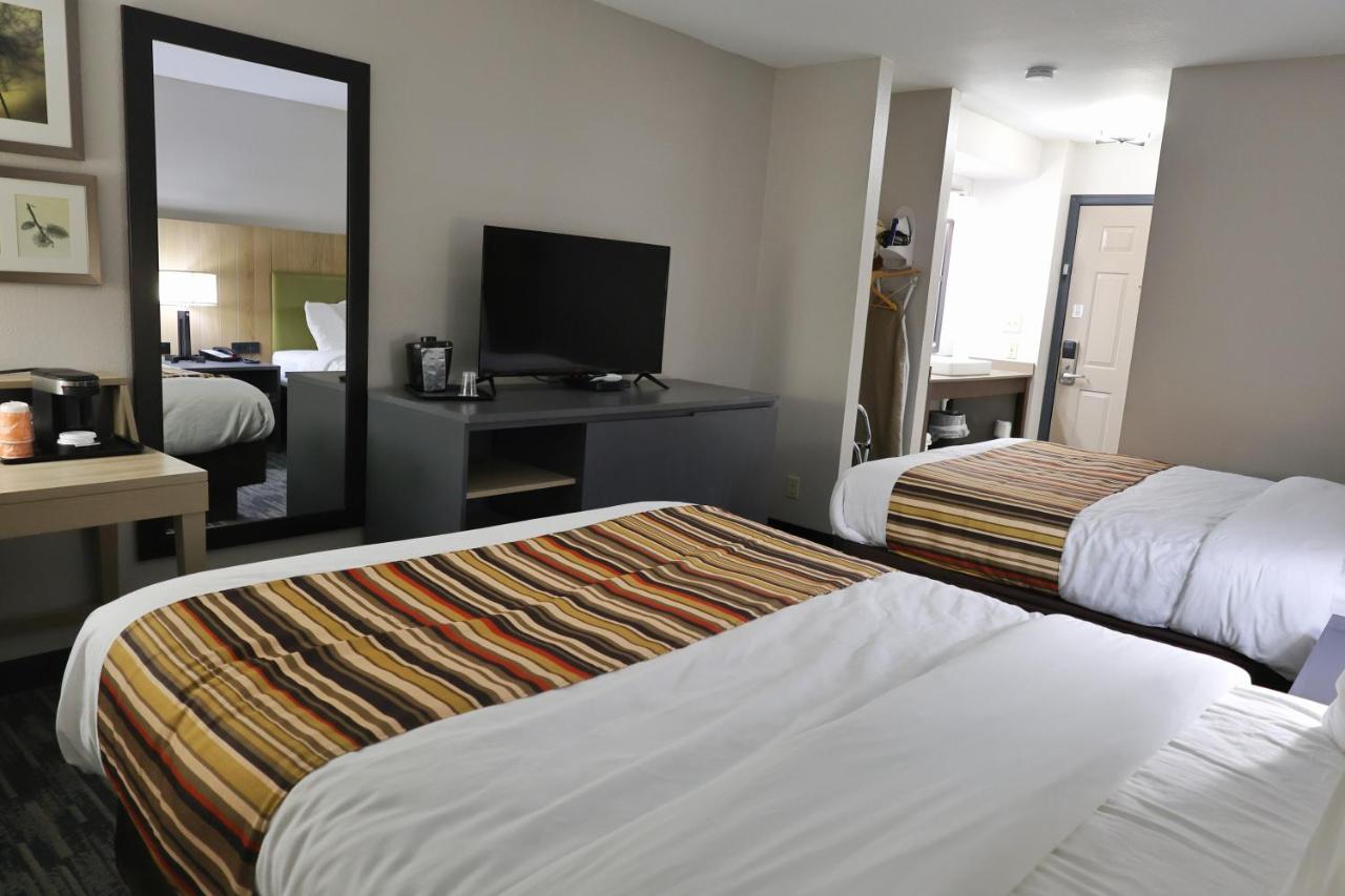 Queen Room with Two Queen Beds at Country Inn & Suites by Radisson, Sparta, WI