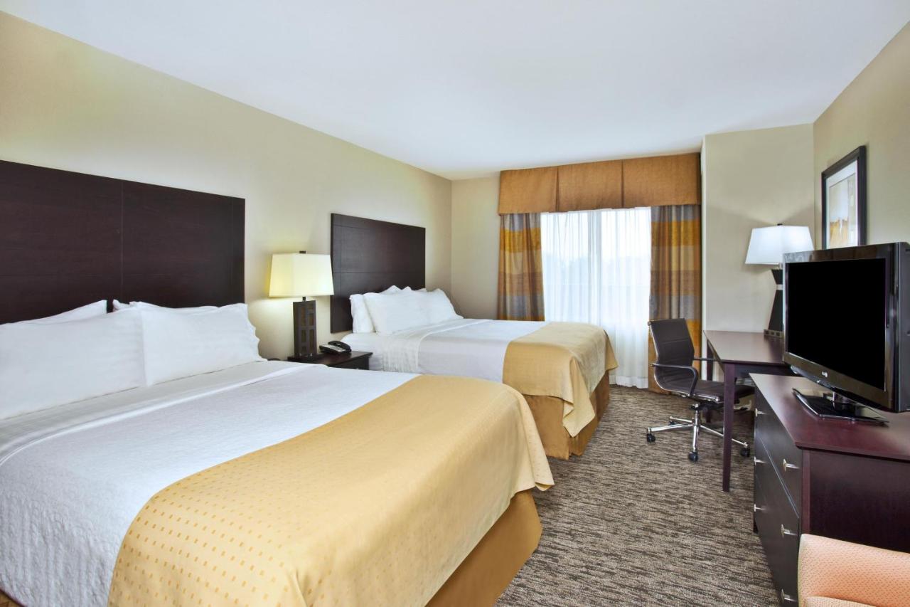 Queen Room with Two Queen Beds at Holiday Inn & Suites Green Bay Stadium, an IHG Hotel