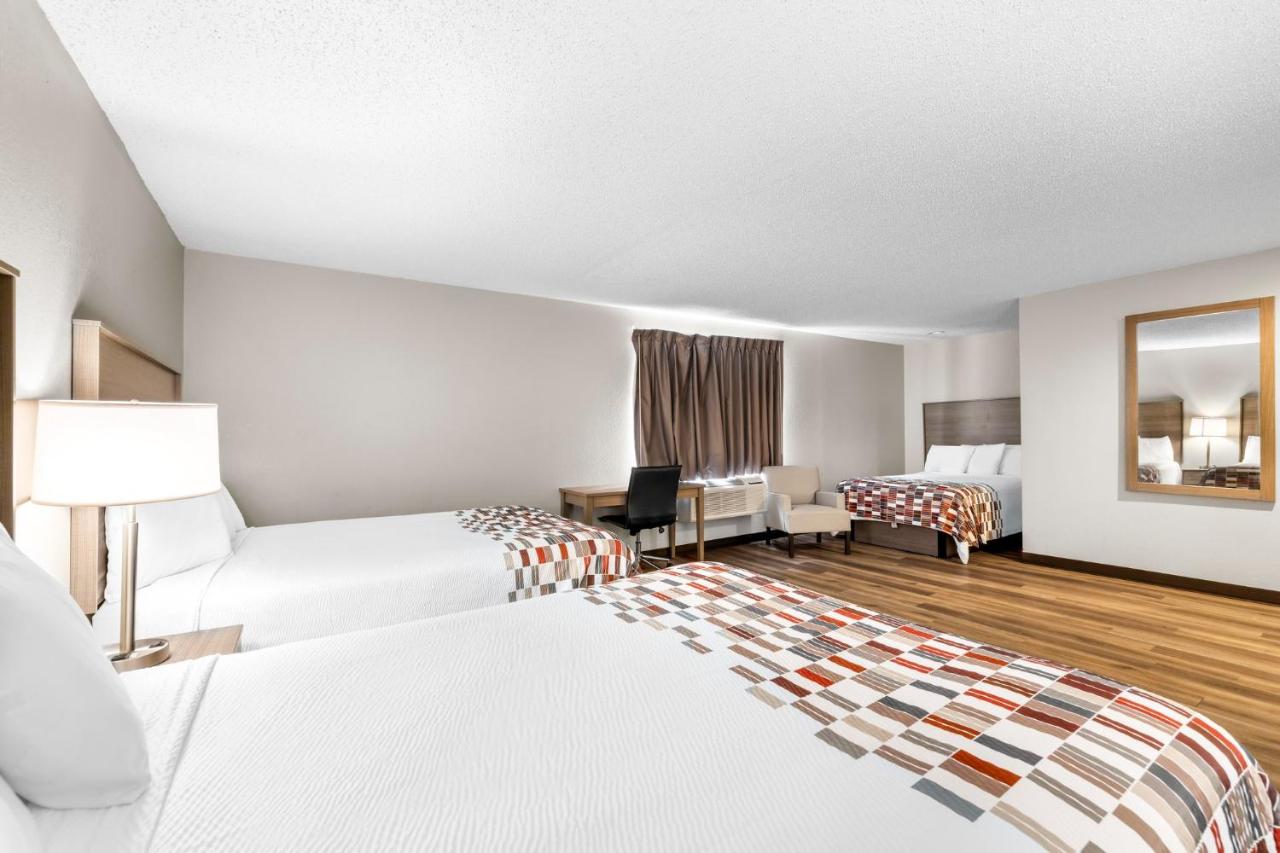 Deluxe Room with Two Queen Beds and One Double Bed Non-Smoking at Red Roof Inn Niagara Falls