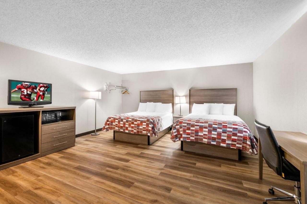 Deluxe Room with Two Queen Beds and One Double Bed Non-Smoking at Red Roof Inn Niagara Falls