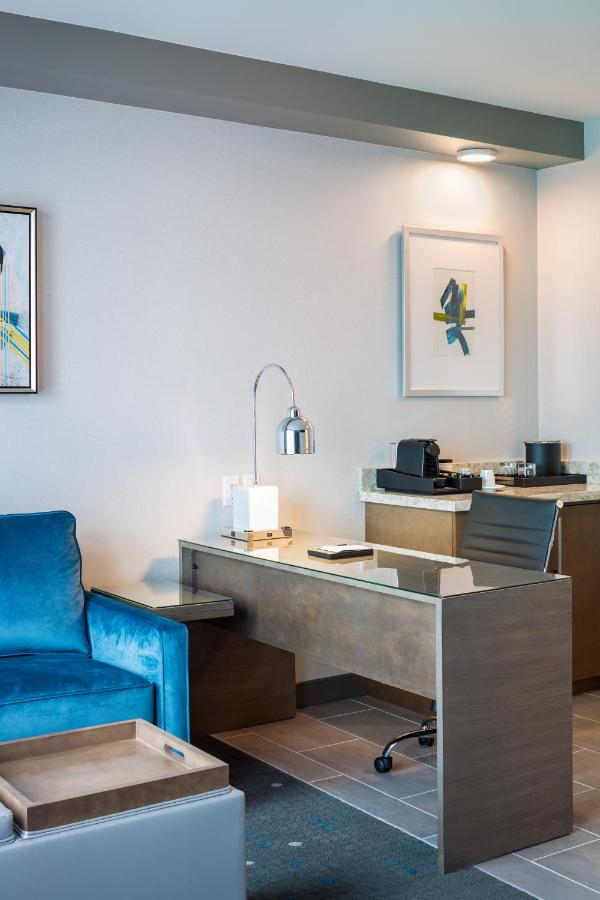 King Suite with Sofa Bed and Roll-In Shower - Mobility Access at Best Western Premier Hotel at Fisher's Landing