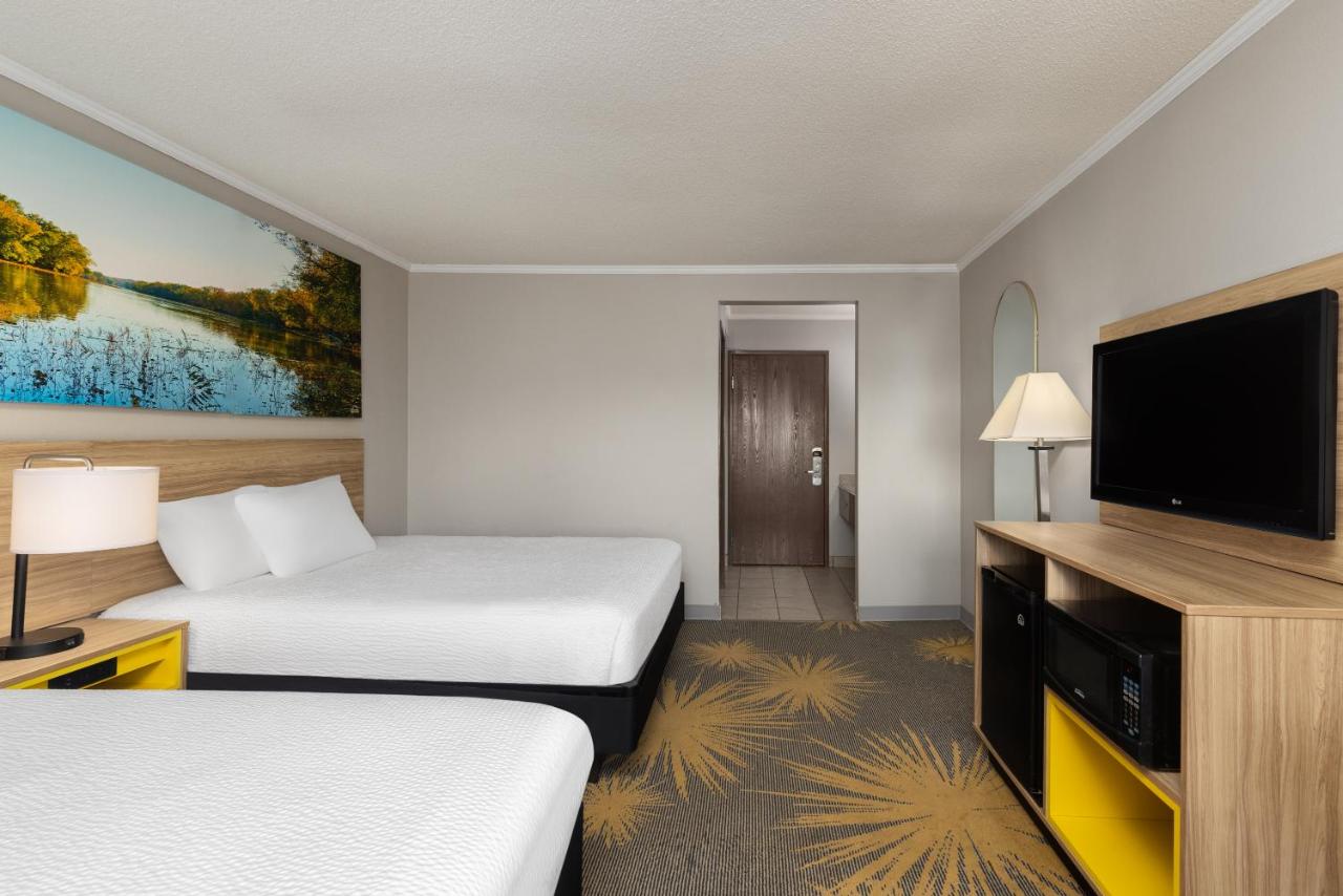 Queen Room with Two Queen Beds - Smoking at Days Inn & Suites by Wyndham Kansas City South