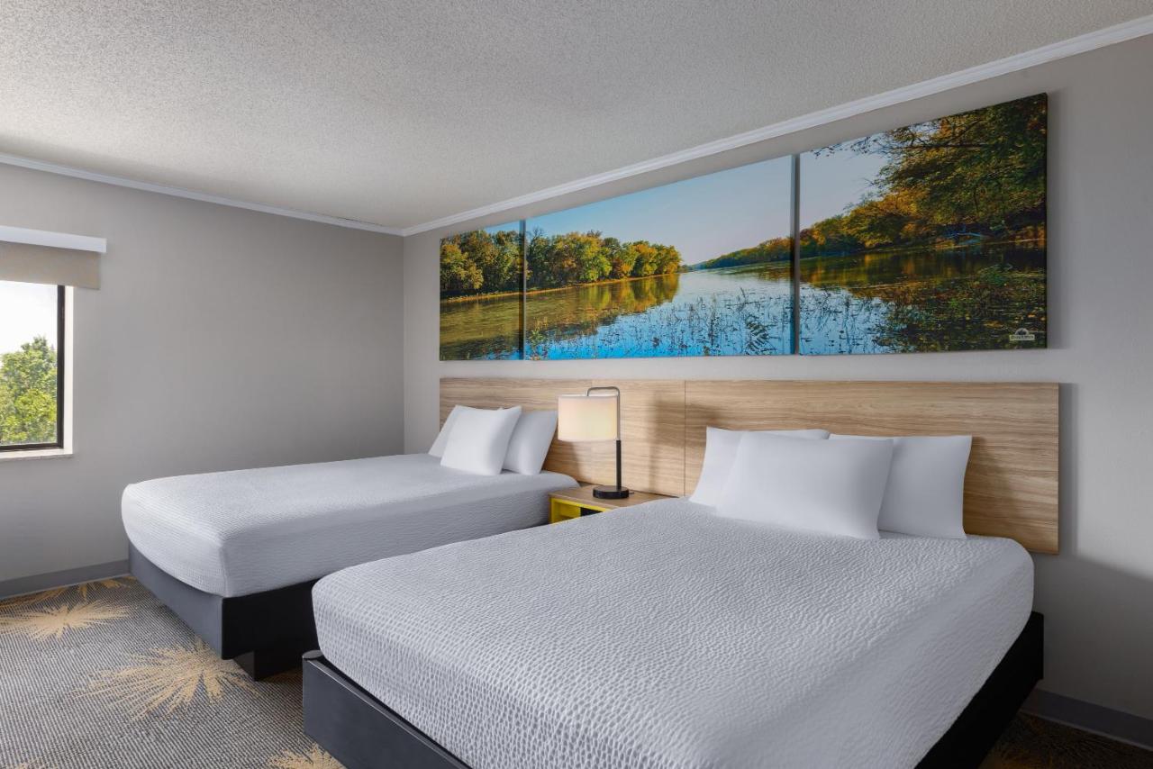 Queen Room with Two Queen Beds - Smoking at Days Inn & Suites by Wyndham Kansas City South