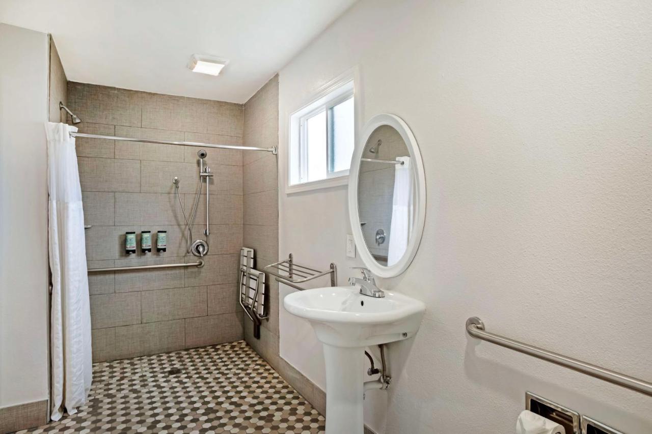 Queen Room with Two Queen Beds and Mobility Accessible Roll-In Shower at Best Western Inn