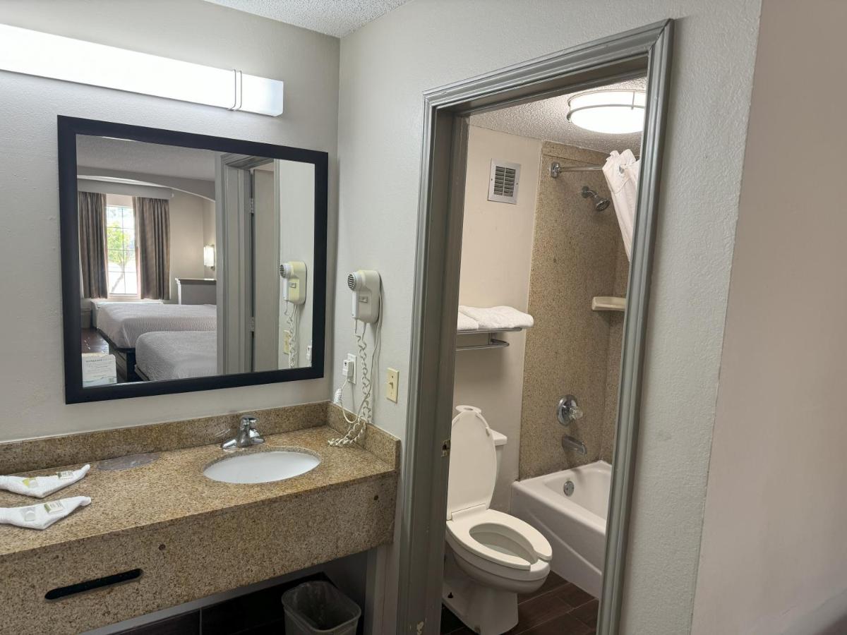 Queen Room with Two Queen Beds - Non-Smoking at Days Inn & Suites by Wyndham Tuscaloosa - Univ. of Alabama