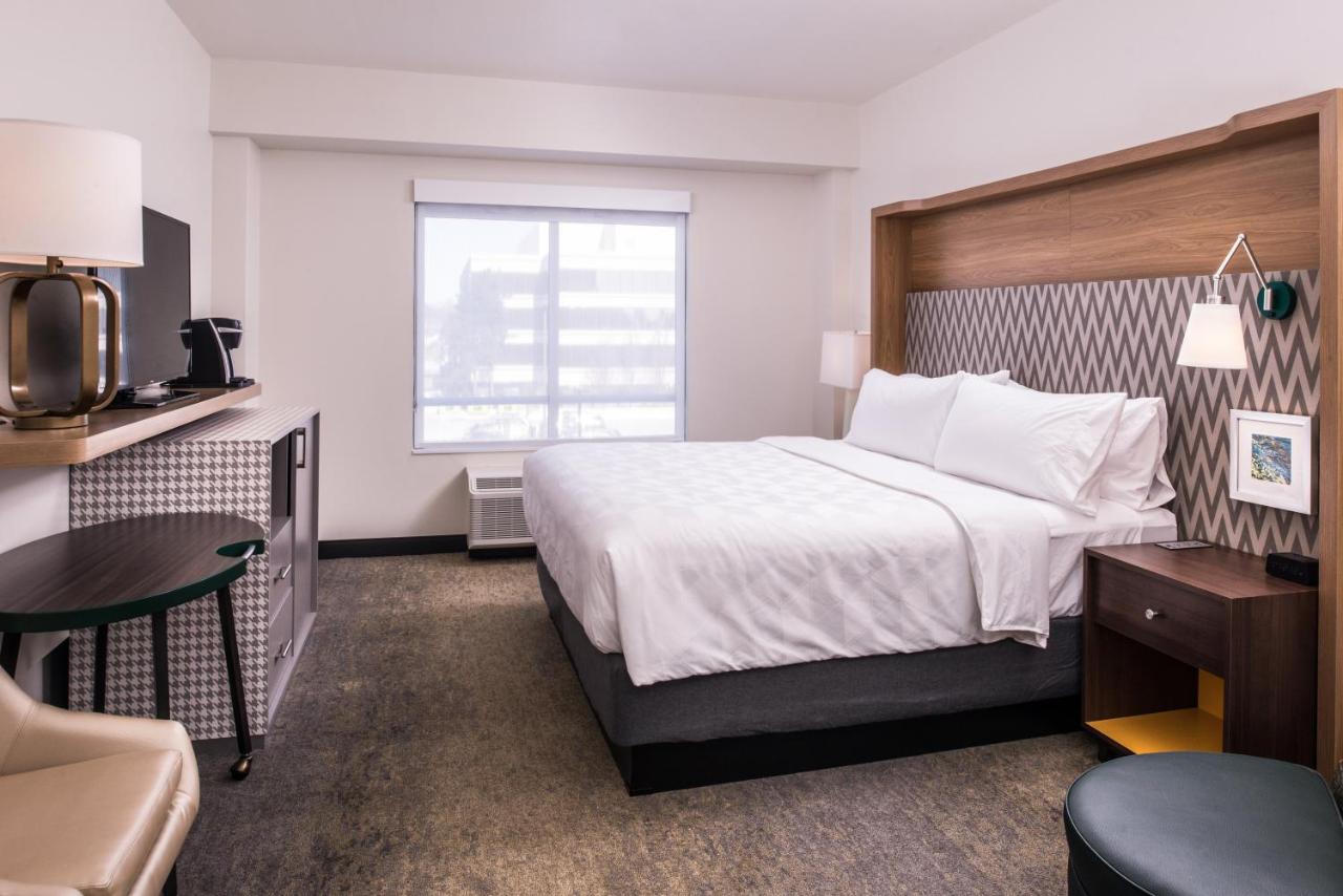 King Suite with Mobility Accessible Roll-In Shower at Holiday Inn Detroit Northwest - Livonia, an IHG Hotel