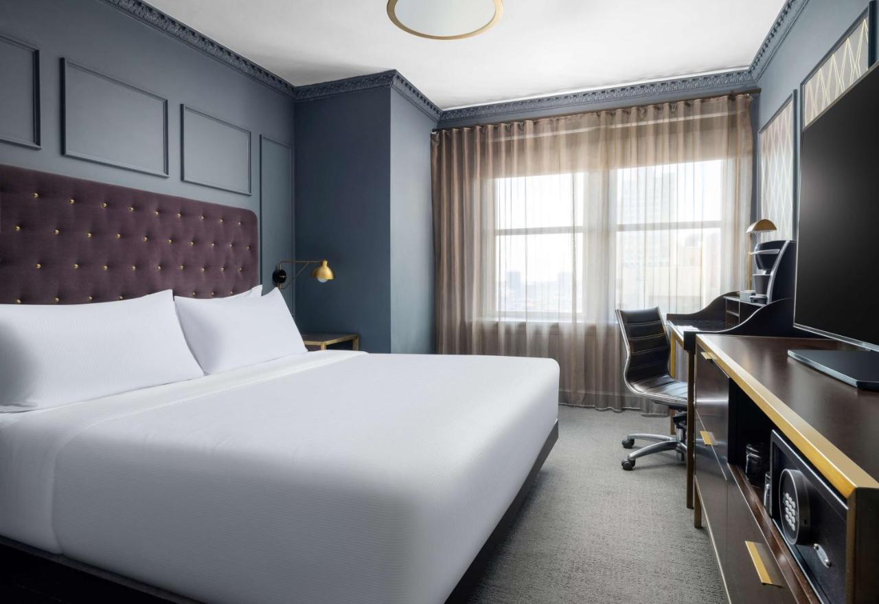 Small Queen Room at Hotel Phillips Kansas City Curio Collection by Hilton