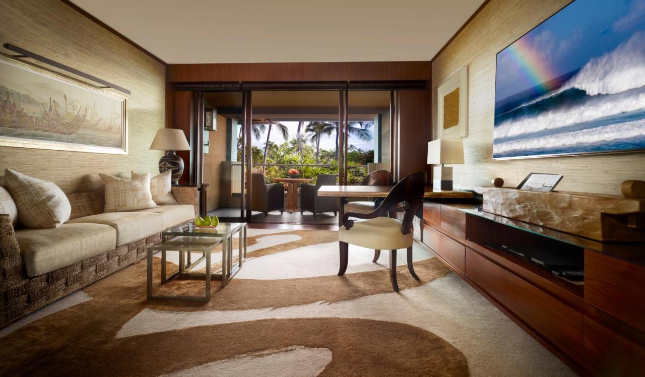 Ohana Partial Ocean View Suite king bed at Four Seasons Resort Lanai