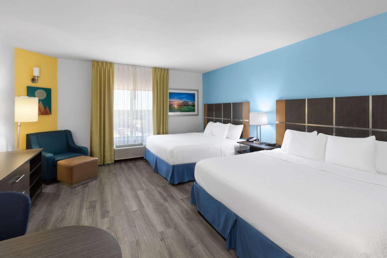 King Room with Two King Beds - Non-Smoking at Days Inn & Suites by Wyndham Lubbock Medical Center