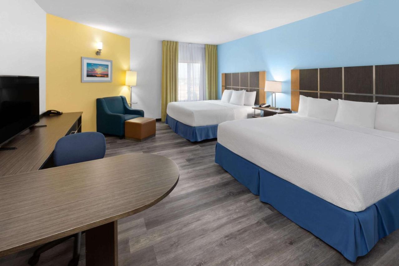 King Room with Two King Beds - Non-Smoking at Days Inn & Suites by Wyndham Lubbock Medical Center