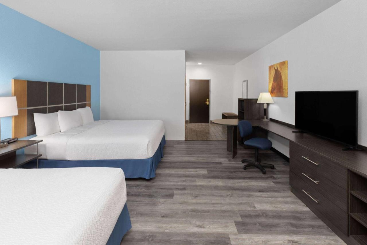 King Room with Two King Beds - Non-Smoking at Days Inn & Suites by Wyndham Lubbock Medical Center