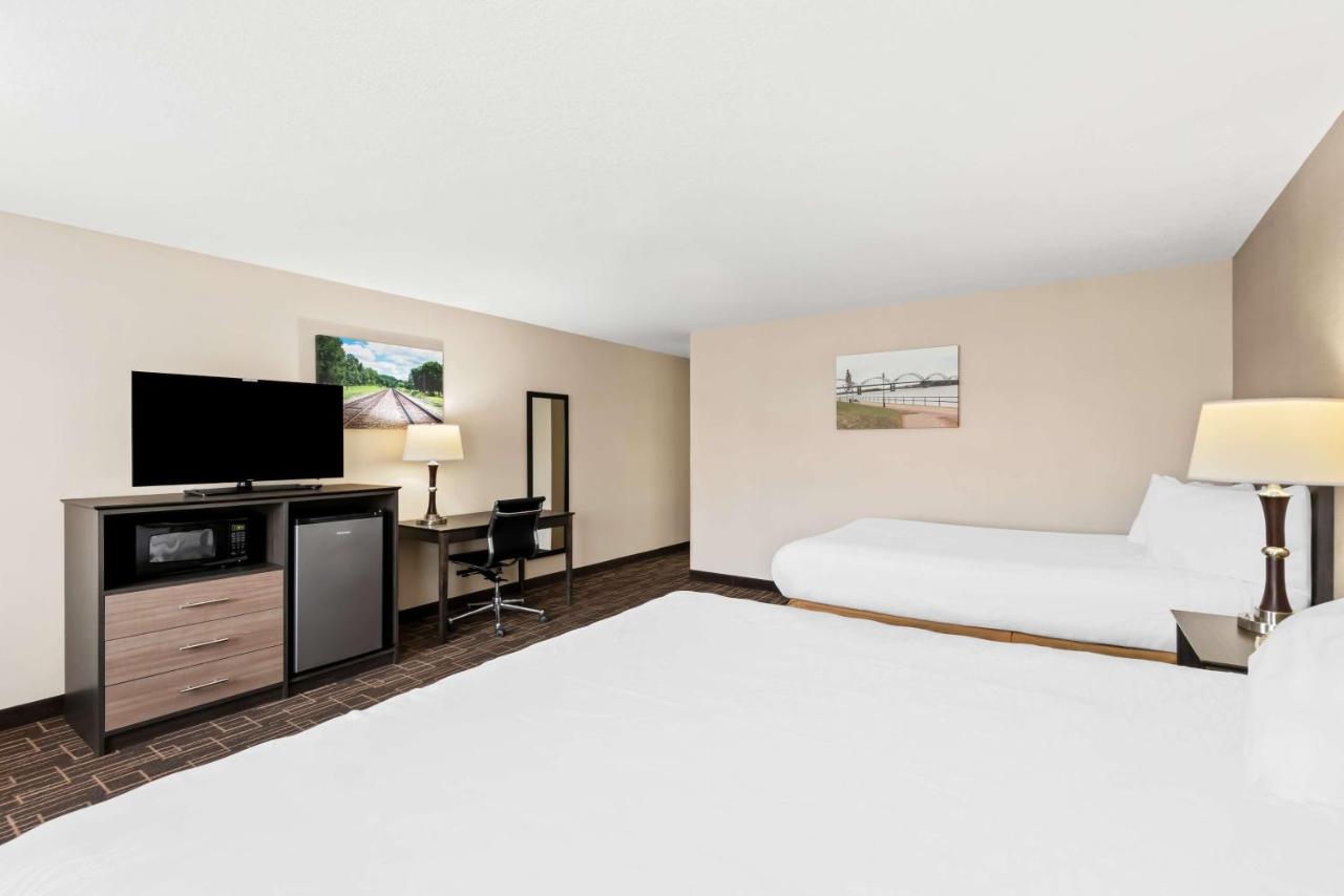 Large Room with One King and One Queen Bed at Best Western Airport Inn