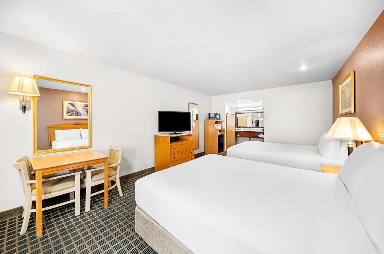 Queen Room with Two Queen Beds at SureStayPlus Hotel by Best Western San Jose Central City