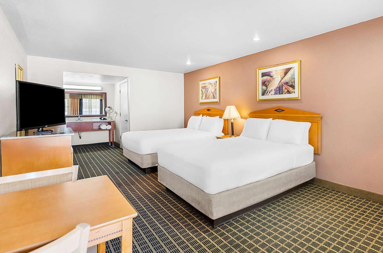 Queen Room with Two Queen Beds at SureStayPlus Hotel by Best Western San Jose Central City