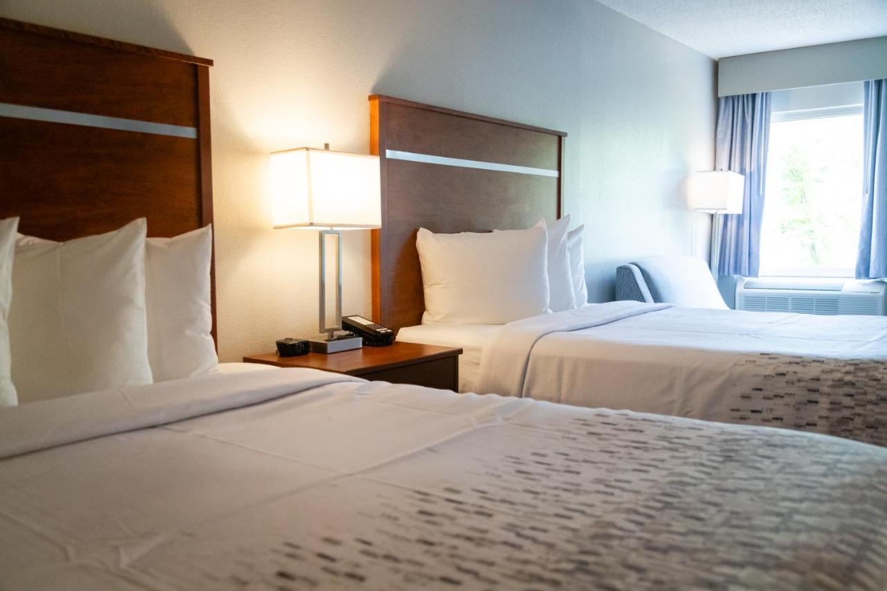 Queen Room with Two Queen Beds w/ fire place & private balcony at Twin Mountain Inn & Suites