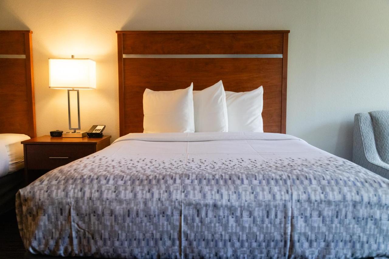 Queen Room with Two Queen Beds w/ fire place & private balcony at Twin Mountain Inn & Suites
