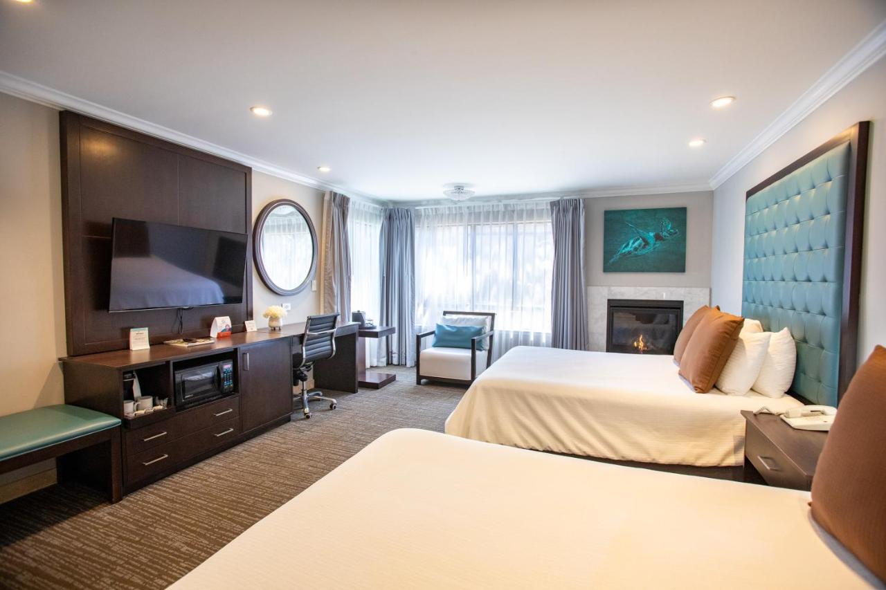 Queen Room with Two Queen Beds and Fireplace at Munras Inn