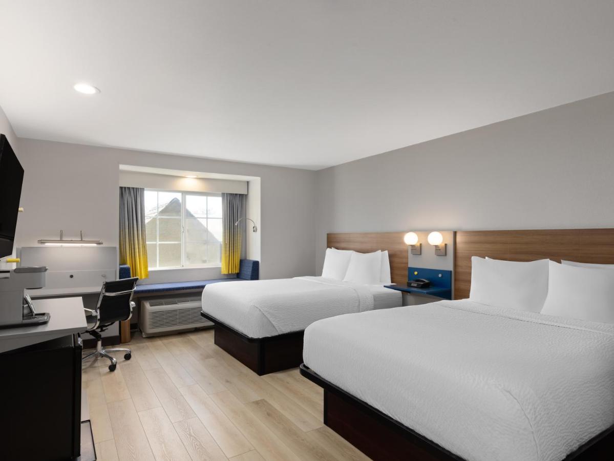 Queen Room with Two Queen Beds - Non-Smoking at Microtel Inn & Suites by Wyndham Tracy