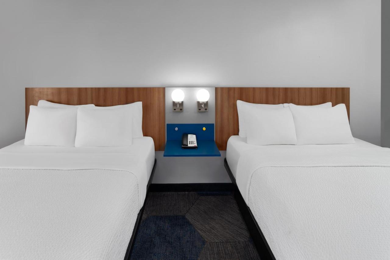 Queen Room with Two Queen Beds - Non-Smoking at Microtel Inn by Wyndham Janesville
