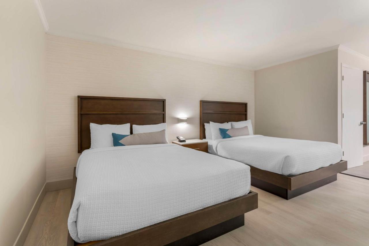 Queen Suite with Two Queen Beds and Sofa Bed at Best Western Plus All Suites Inn