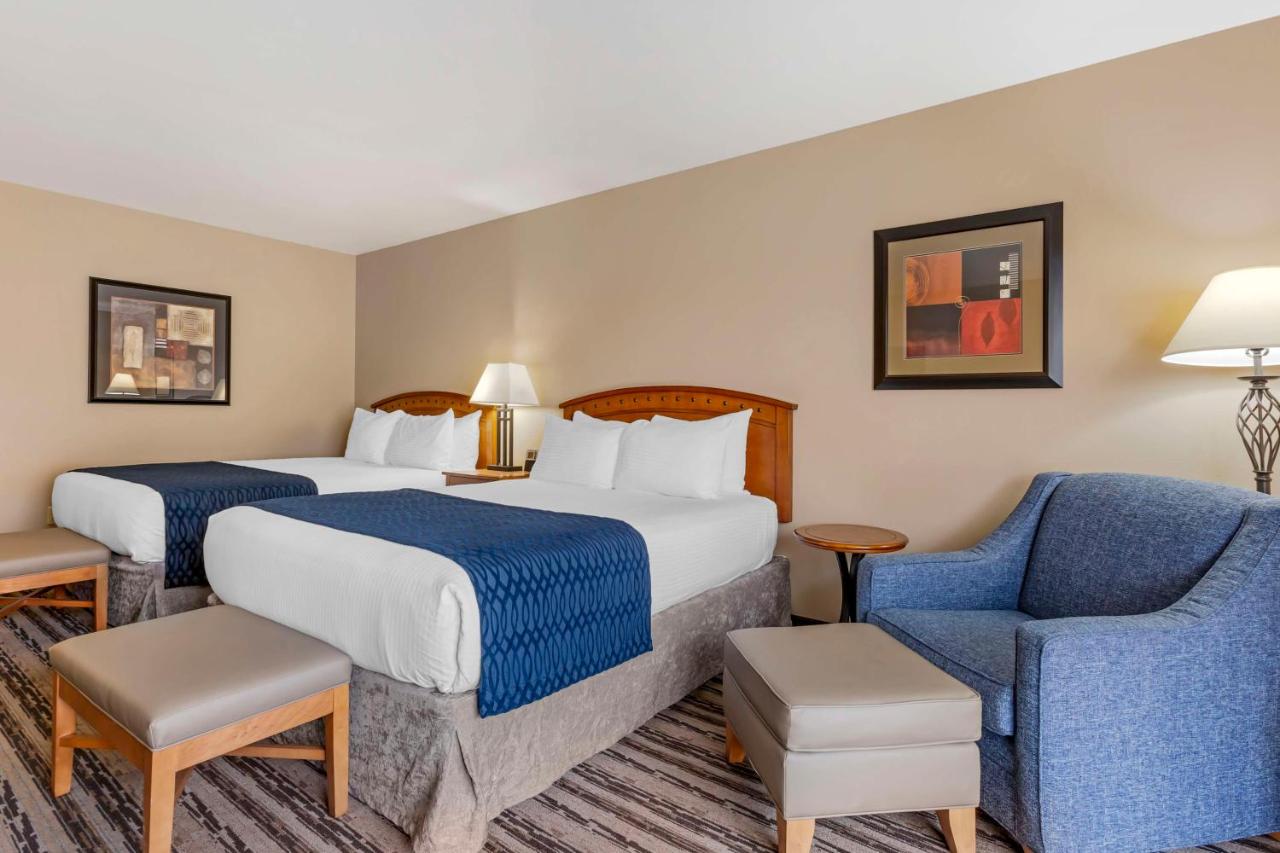 Queen Room with Two Queen Beds and Patio at Best Western Sunset Inn
