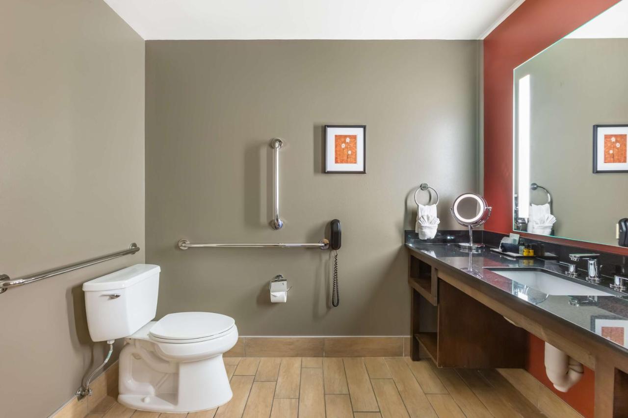 King Suite with Roll-In Shower and Balcony - Disability Access at Best Western Premier Ivy Inn & Suites