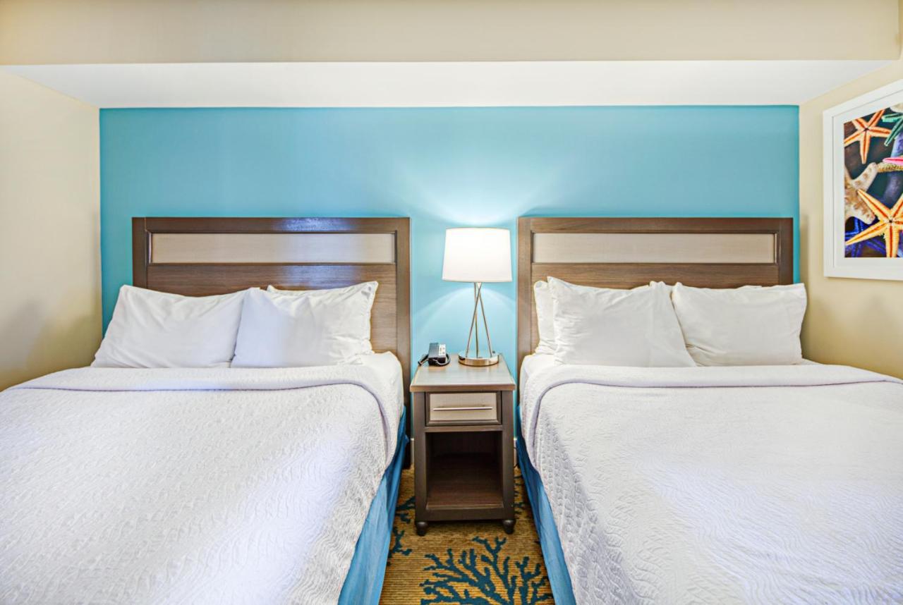 Ocean Front Suite Two Queen Beds with Balcony at Commander Hotel & Suites