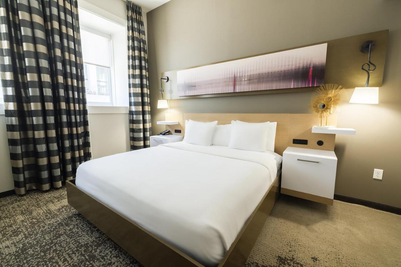 King Suite with Sofa Bed and Roll-in Shower - Accessible/Non-Smoking at voco Hotel Napoleon Memphis by IHG
