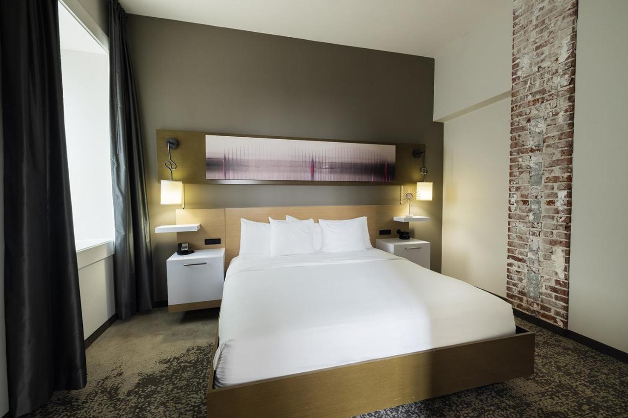 King Suite with Sofa Bed and Roll-in Shower - Accessible/Non-Smoking at voco Hotel Napoleon Memphis by IHG