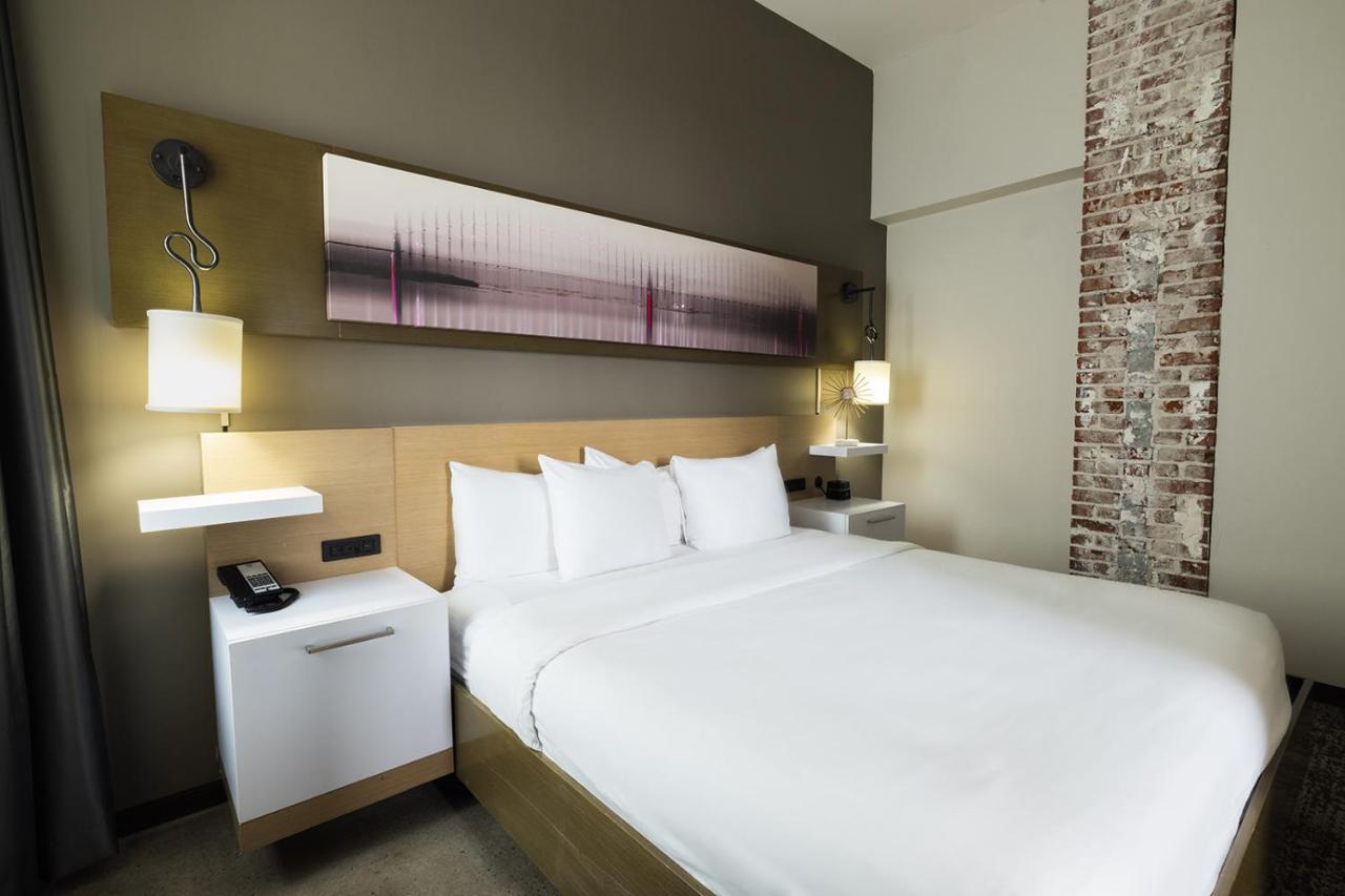 King Suite with Sofa Bed and Roll-in Shower - Accessible/Non-Smoking at voco Hotel Napoleon Memphis by IHG