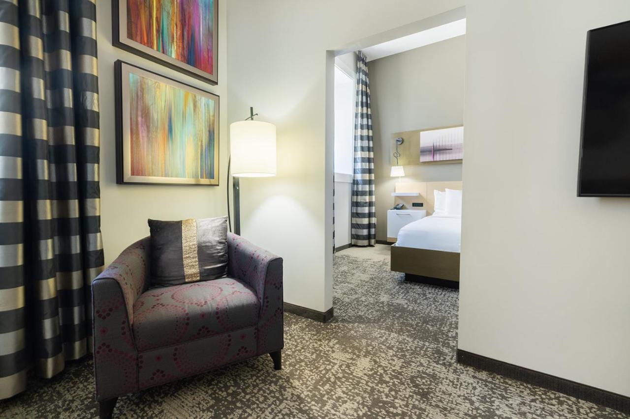 King Suite with Sofa Bed and Roll-in Shower - Accessible/Non-Smoking at voco Hotel Napoleon Memphis by IHG