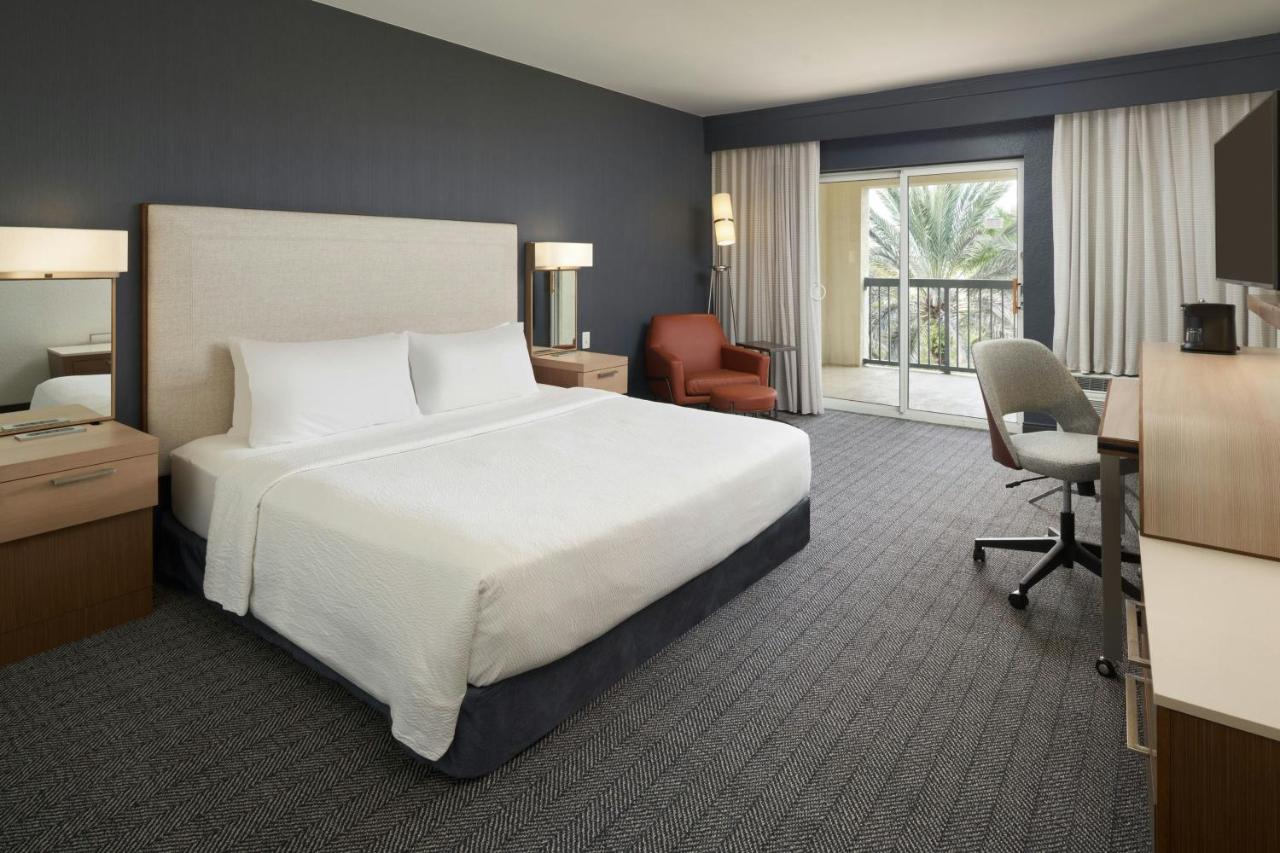 King Room with Sofa Bed and Balcony at Courtyard by Marriott Fort Lauderdale Weston