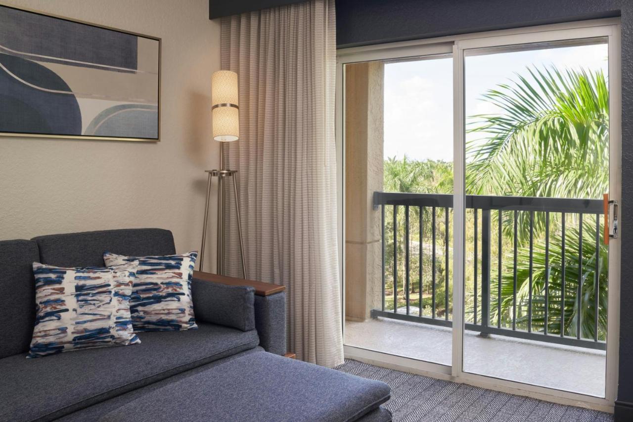 King Room with Sofa Bed and Balcony at Courtyard by Marriott Fort Lauderdale Weston