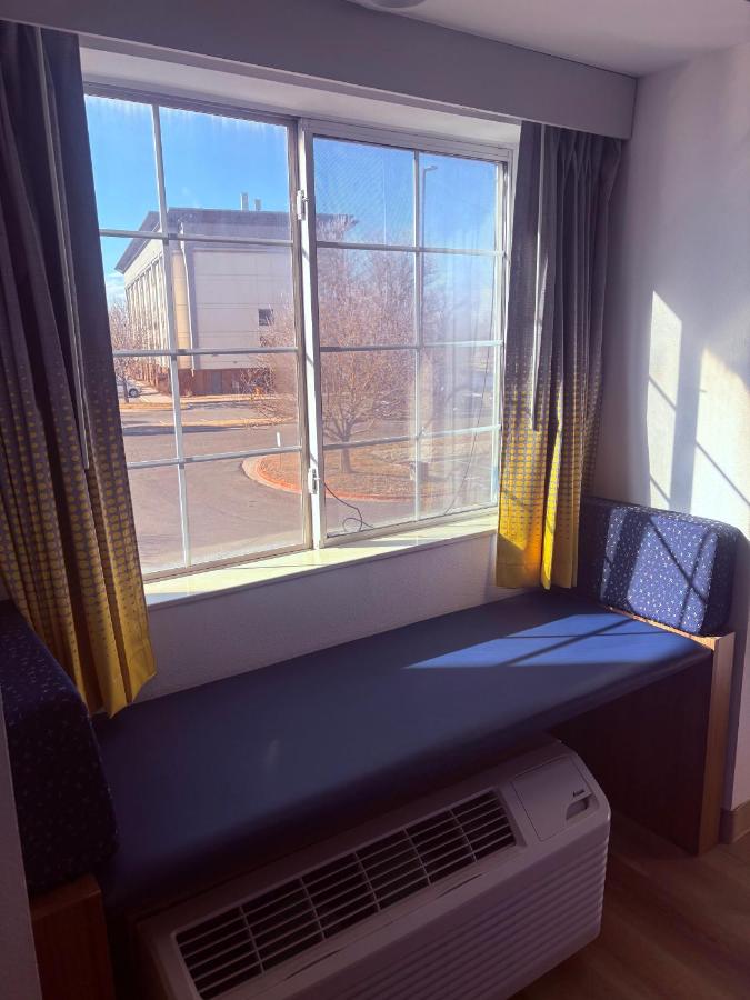 Queen Room with Two Queen Beds - Non-Smoking at Microtel Inn & Suites by Wyndham Denver Airport