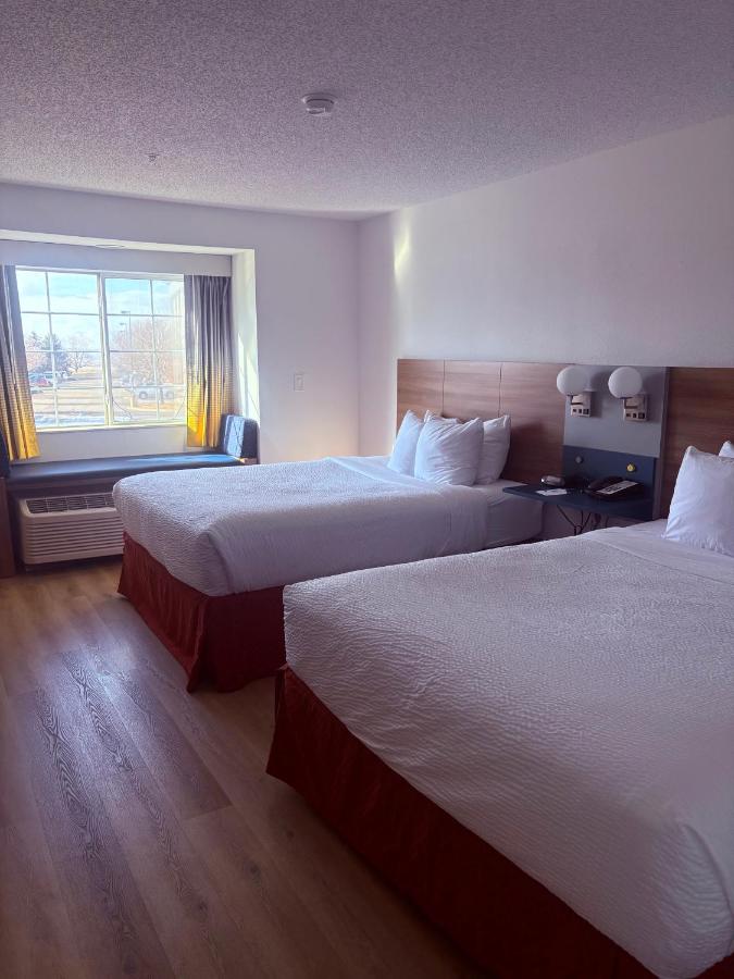Queen Room with Two Queen Beds - Non-Smoking at Microtel Inn & Suites by Wyndham Denver Airport
