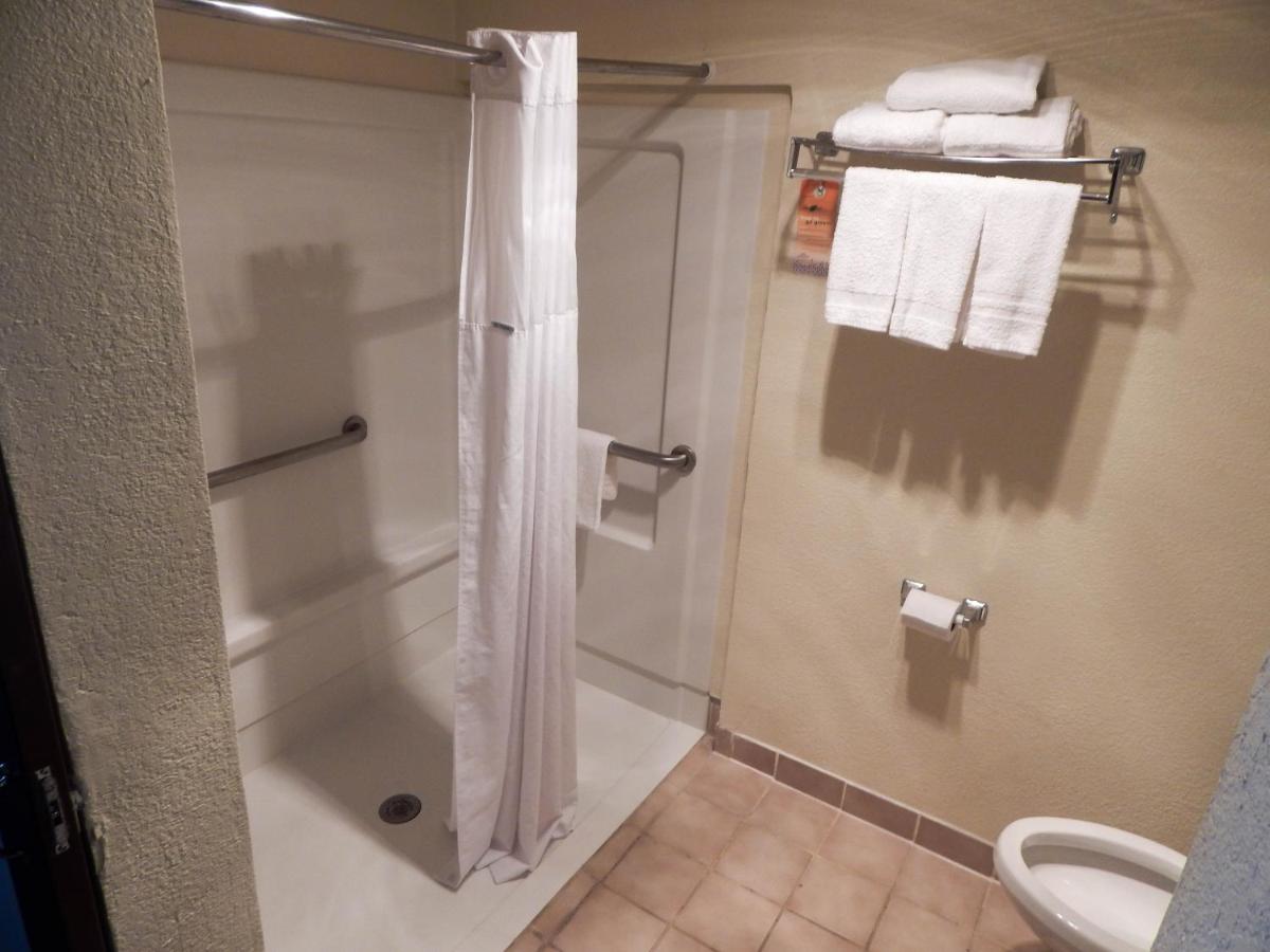 Queen Room with Two Queen Beds and Roll-In Shower - Mobility/Hearing Accessible - Non-Smoking at Howard Johnson by Wyndham Arlington Ballpark / Six Flags