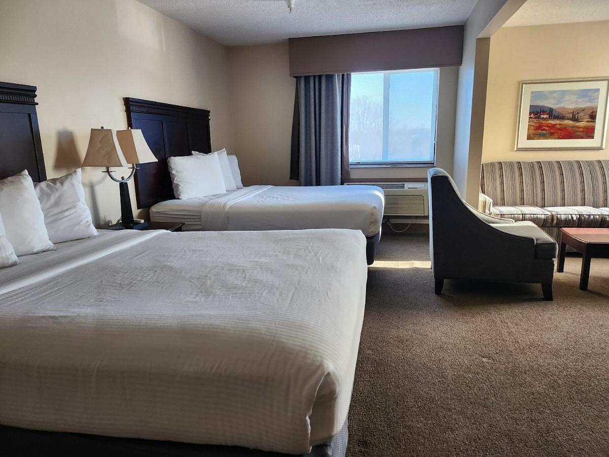 Deluxe Queen Room with Two Queen Beds and Sofa Bed at Ashley Quarters Hotel Cincinnati Airport