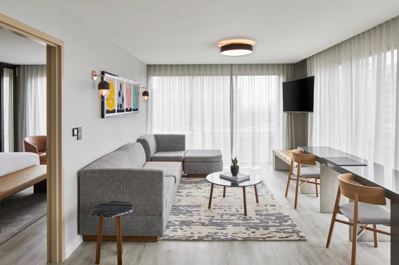 One bedroom suite with king bed, sofa bed and city view at AC Hotel By Marriott Greenville