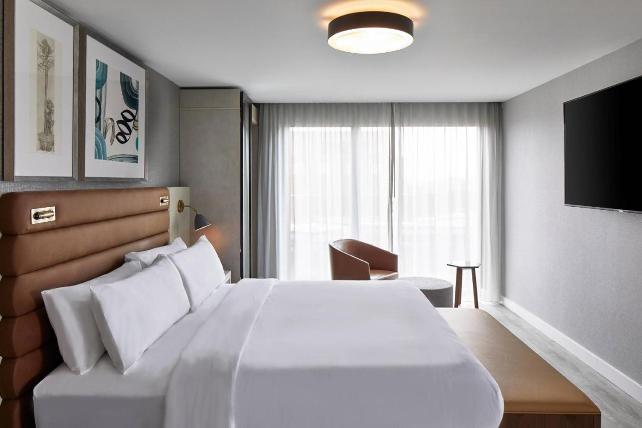 One bedroom suite with king bed, sofa bed and city view at AC Hotel By Marriott Greenville