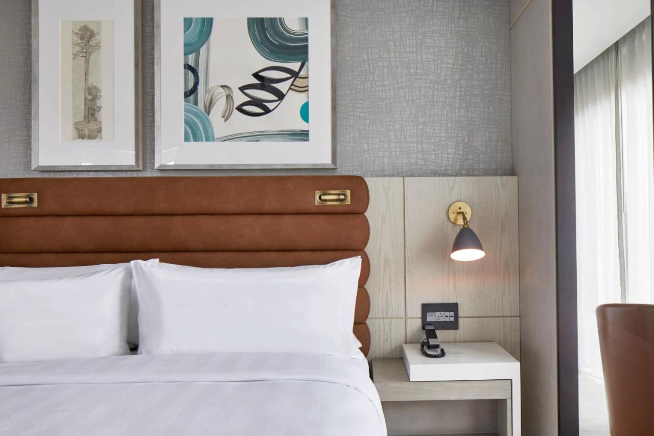 One bedroom suite with king bed, sofa bed and city view at AC Hotel By Marriott Greenville
