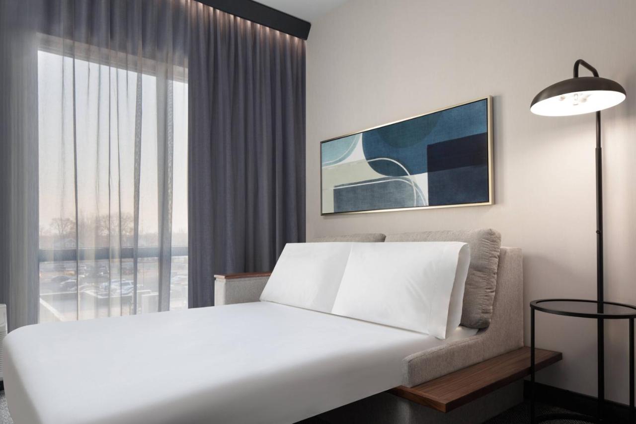 King Room with Sofa Bed and Roll-in Shower - Mobility and Hearing Accessible at Courtyard by Marriott Lansing Downtown