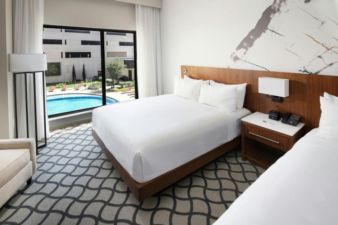 Queen Room with Two Queen Beds and Courtyard View at Marriott Dallas Allen Hotel & Convention Center